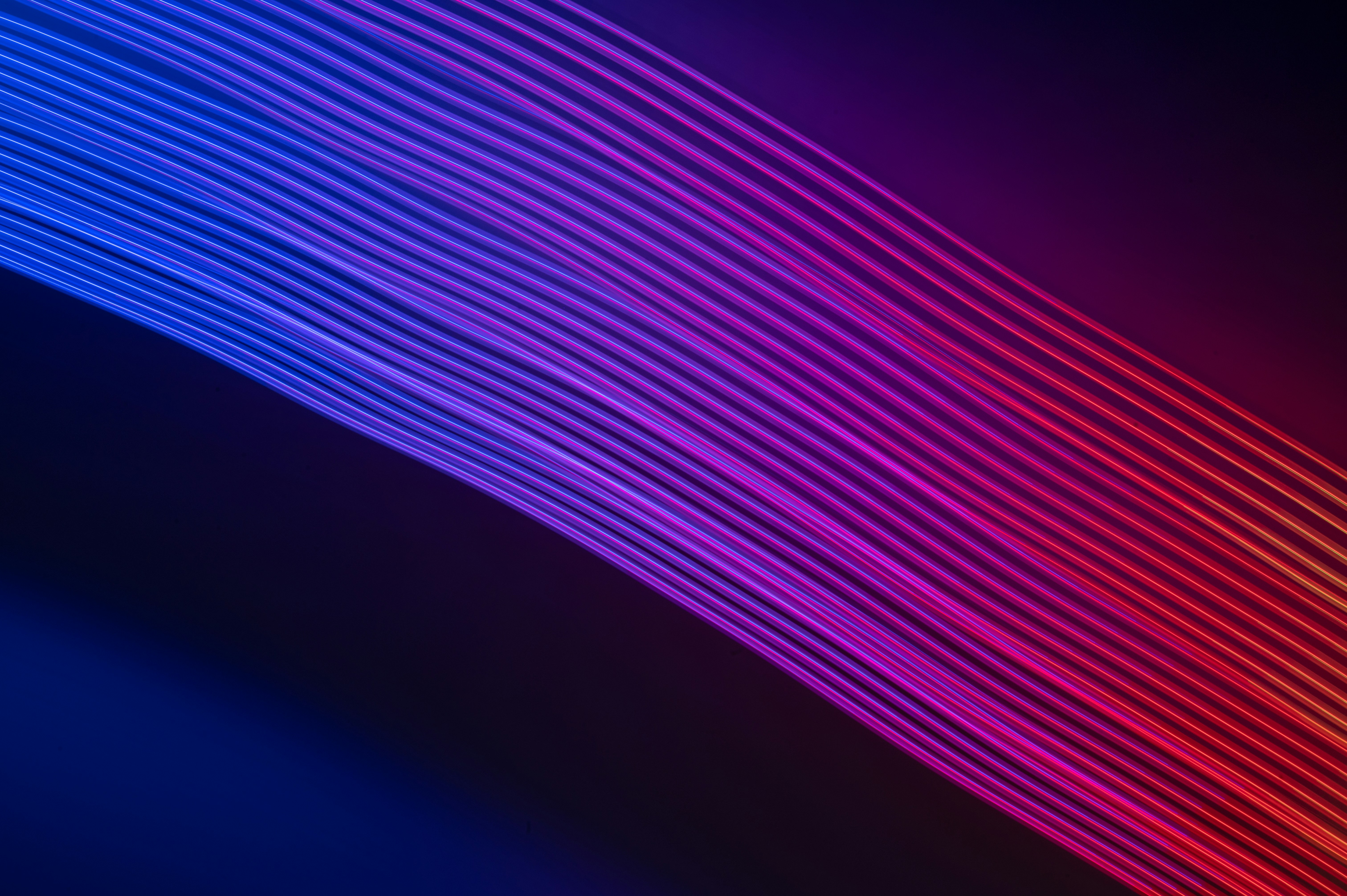 a dark background with lines of different colors