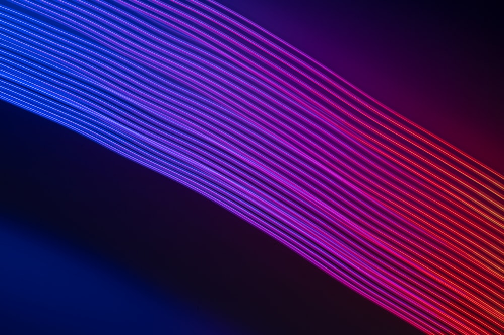 a dark background with lines of different colors