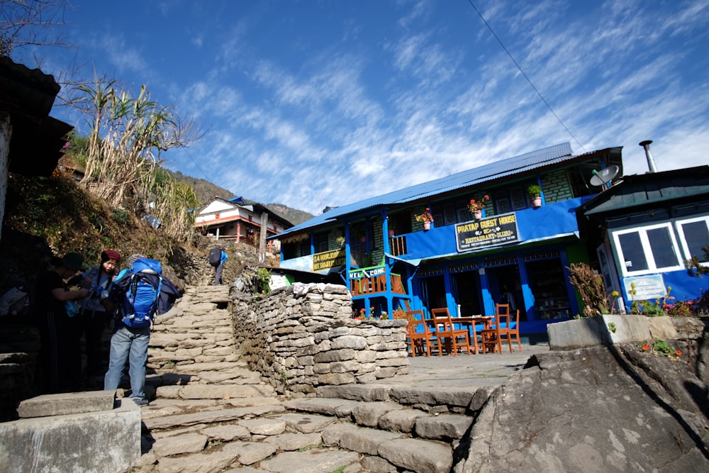 a man with a backpack walking up some steps