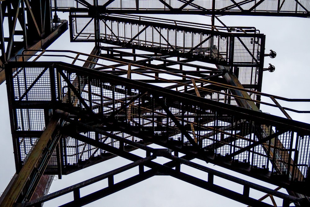 a tall metal structure with a clock on it