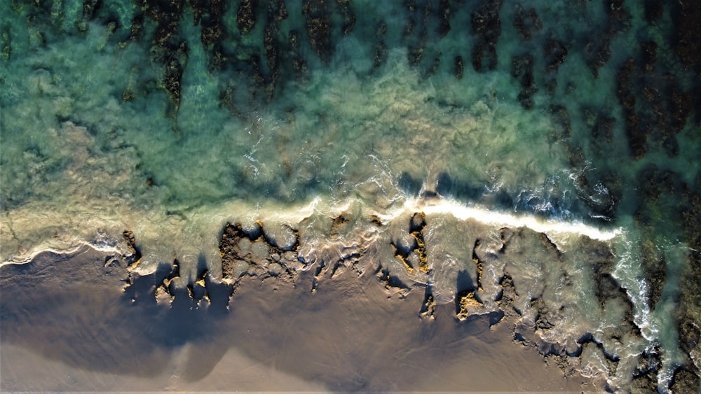 an aerial view of a beach and ocean