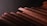 A close-up of construction materials neatly arranged on a wooden table.