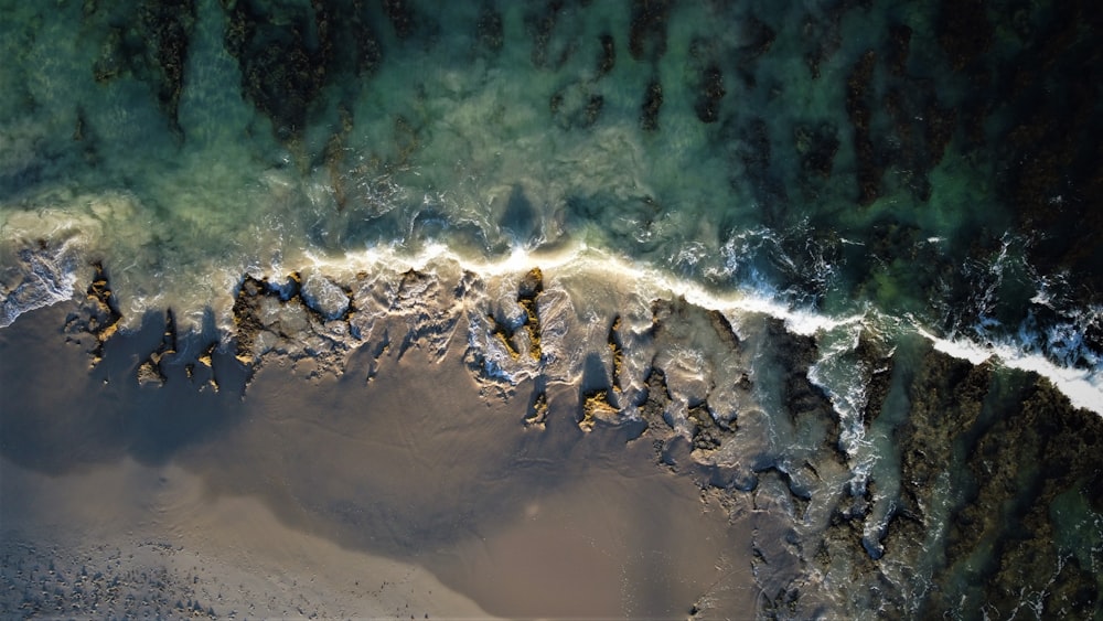 an aerial view of a beach and ocean