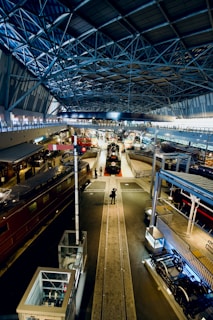 A welcoming entrance to a historic railroad museum with vintage trains on display.