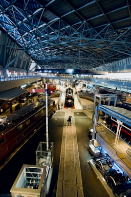 A welcoming entrance to a historic railroad museum with vintage trains on display.