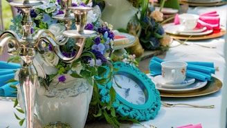 a table topped with a vase filled with flowers