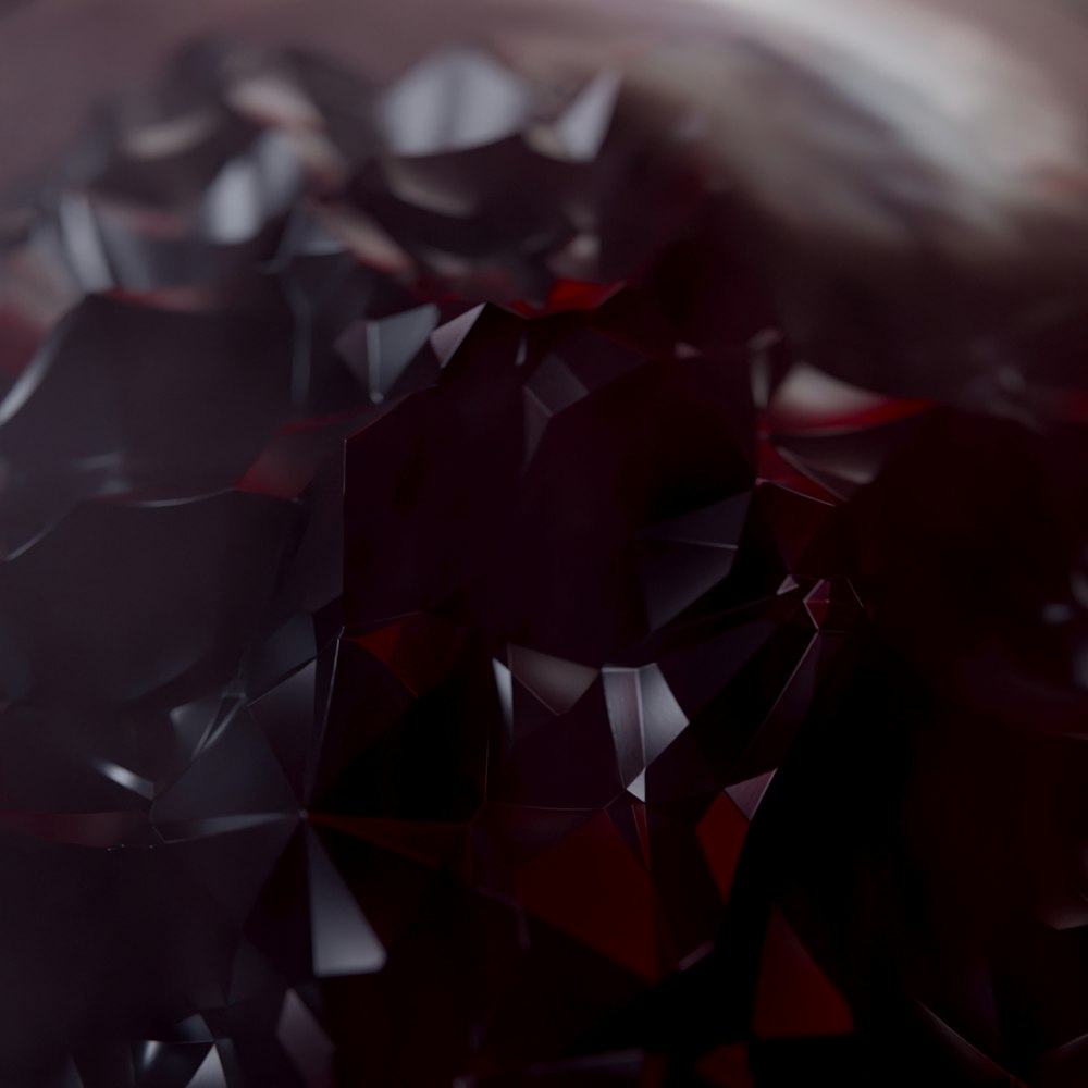 a close up of a red and black diamond