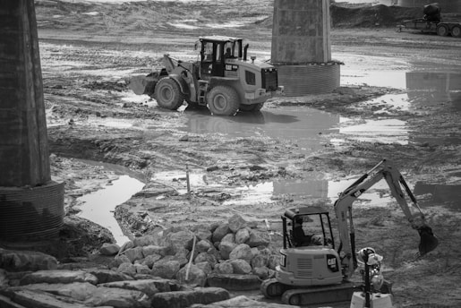 a construction site with a bulldozer in the middle of it