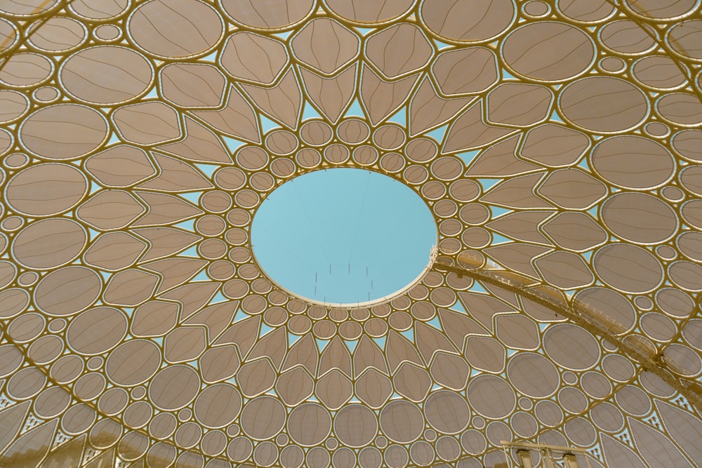 a ceiling with a blue sky in the background