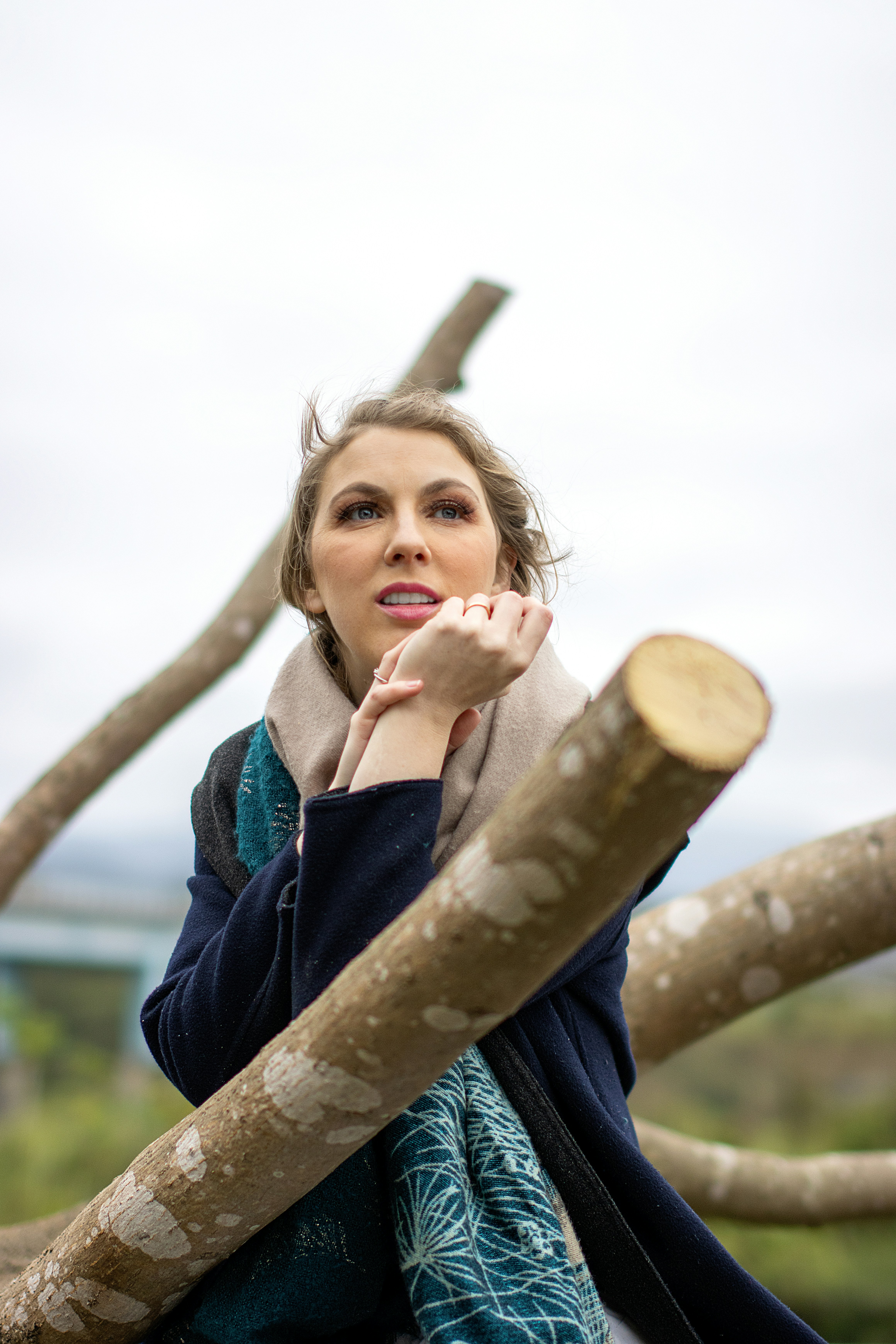 A woman sitting on top of a tree branch photo – Free Face Image on Unsplash
