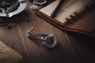 A sleek, elegant desk with a vintage telephone and a leather-bound notebook, hinting at exclusive conversations.