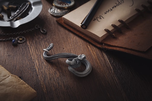 A sleek, elegant desk with a vintage telephone and a leather-bound notebook, hinting at exclusive conversations.