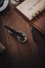 a pen sitting on top of a wooden table