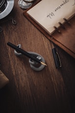 a pen sitting on top of a wooden table