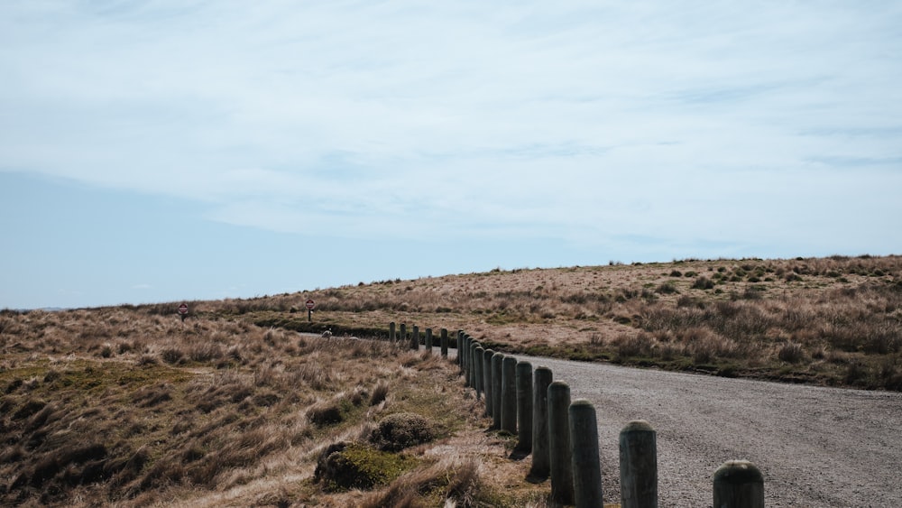 a road with a fence on the side of it