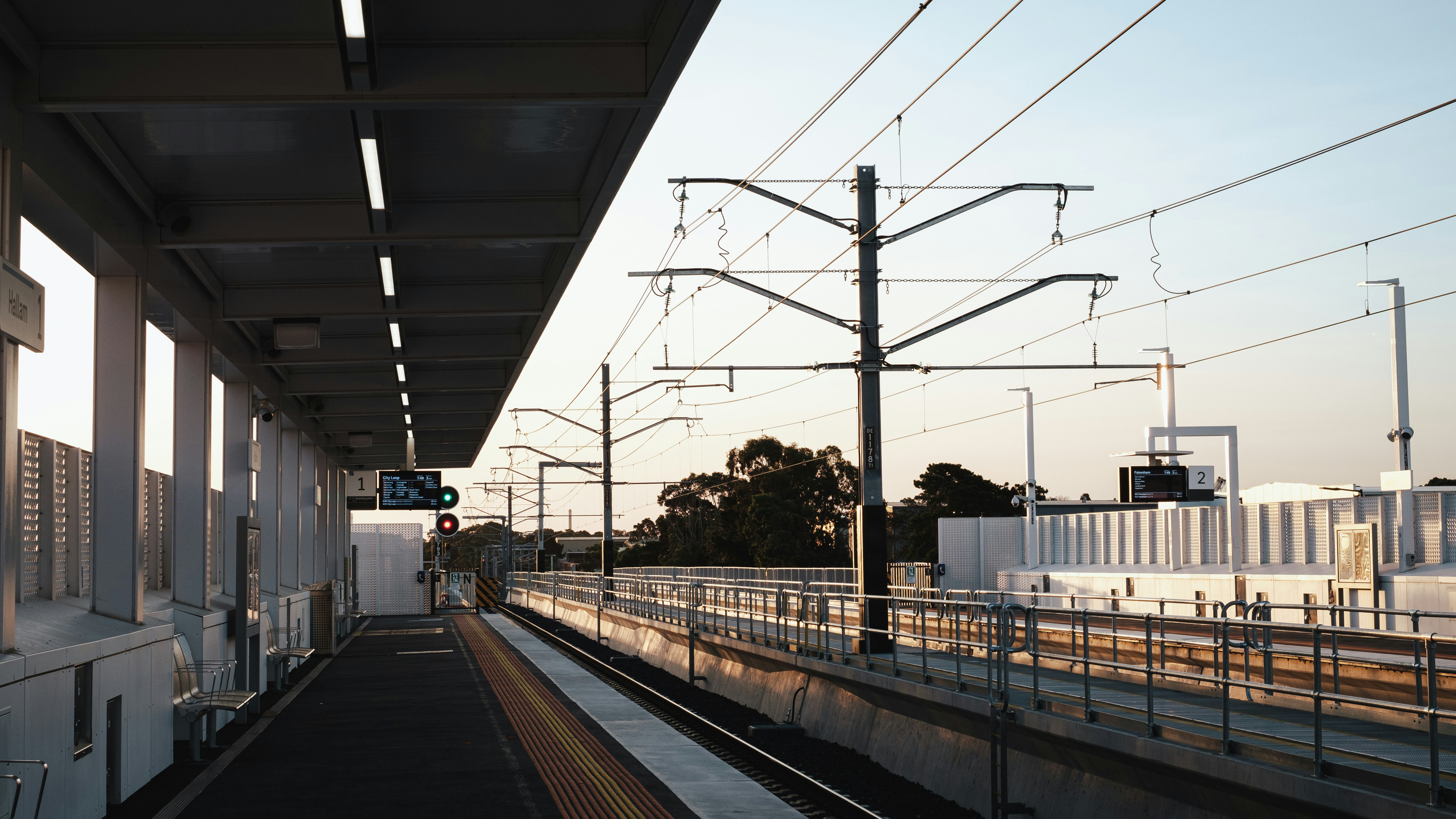 a train station with a train on the tracks