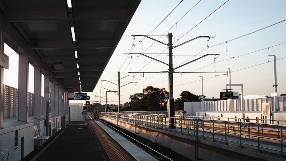 a train station with a train on the tracks