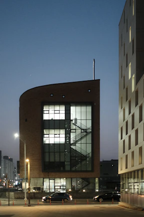 High-quality render of a contemporary commercial building at dusk.