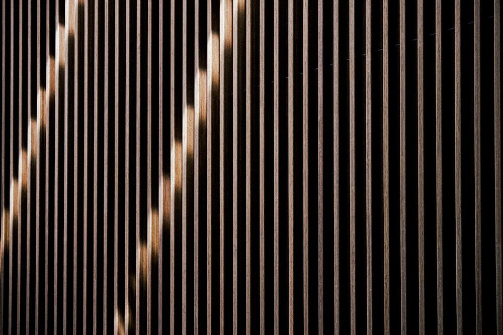 a close up of a building with vertical lines