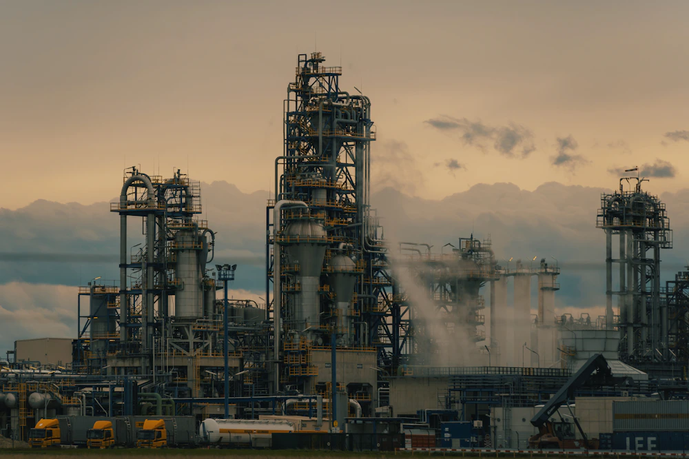 Industrial plant: processing facility with tall chimney stacks