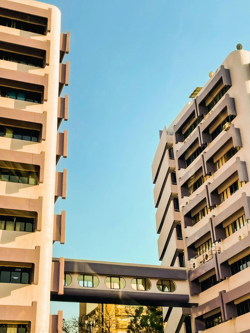 a tall building next to a very tall building