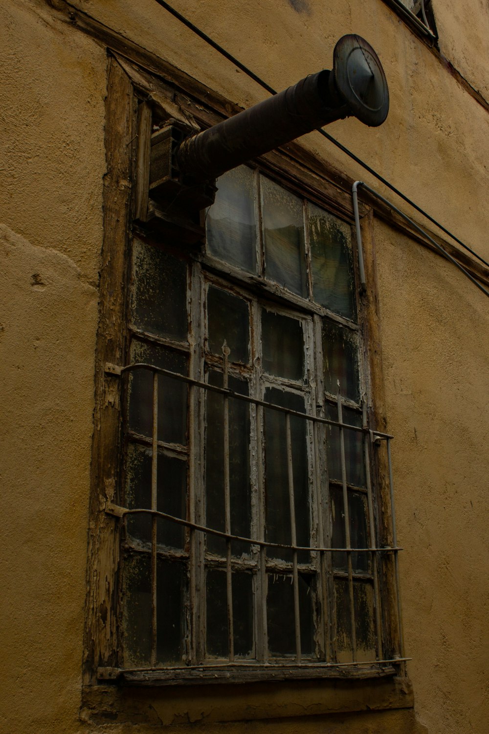 a window with a pipe sticking out of it