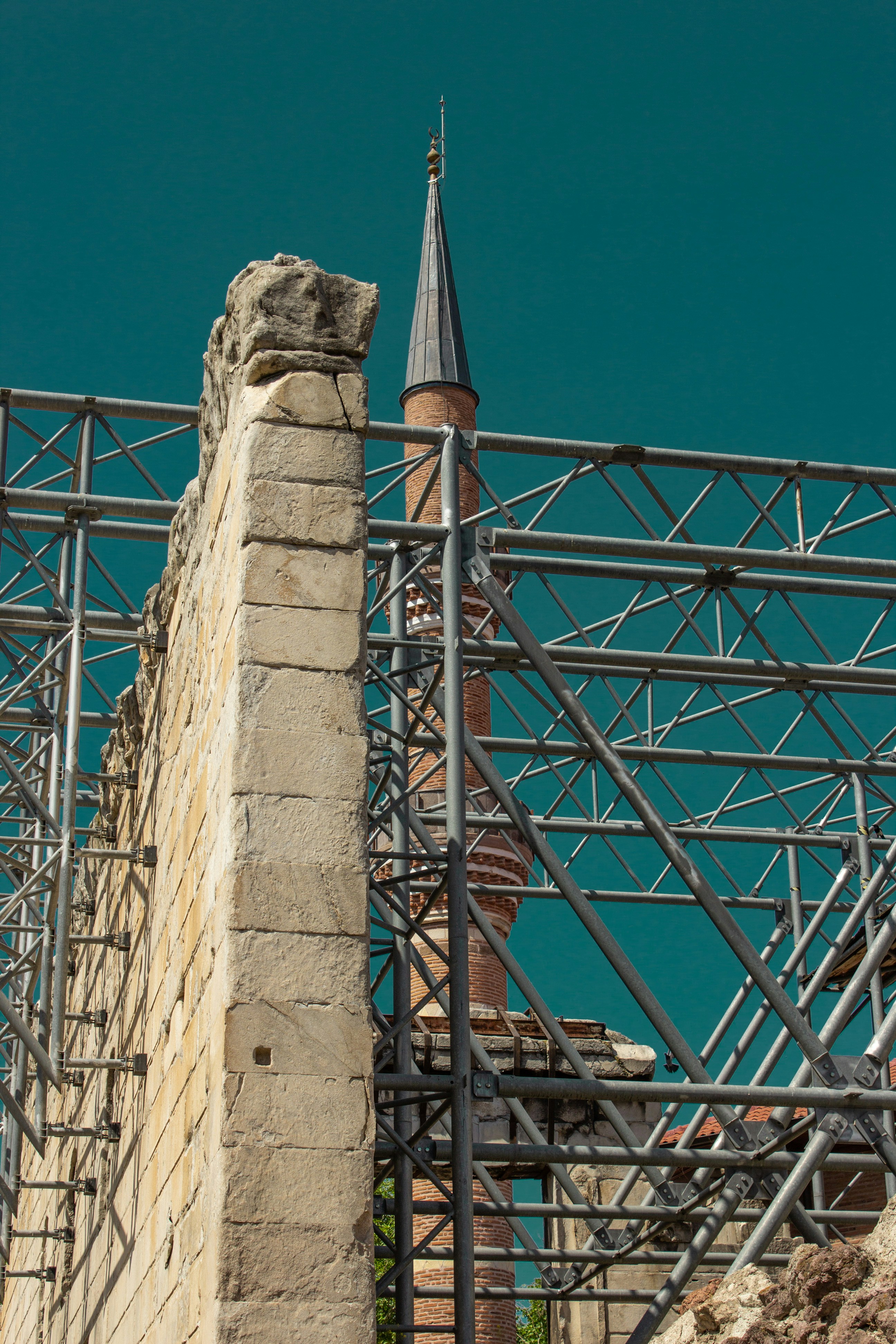 a building with scaffolding and a clock tower