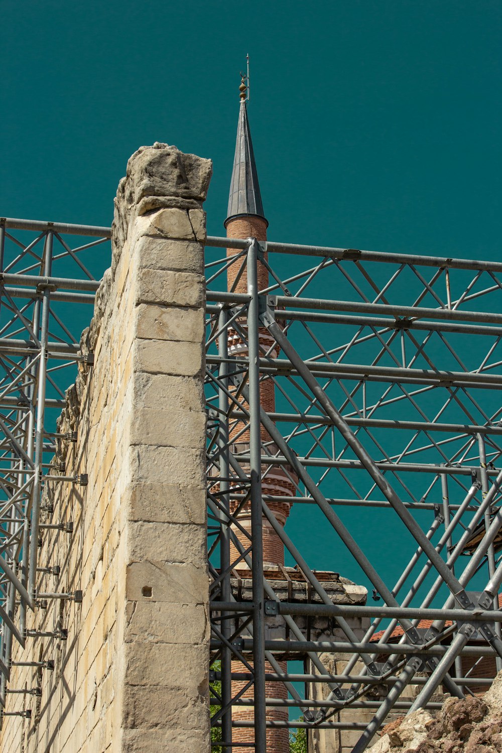 a building with scaffolding and a clock tower