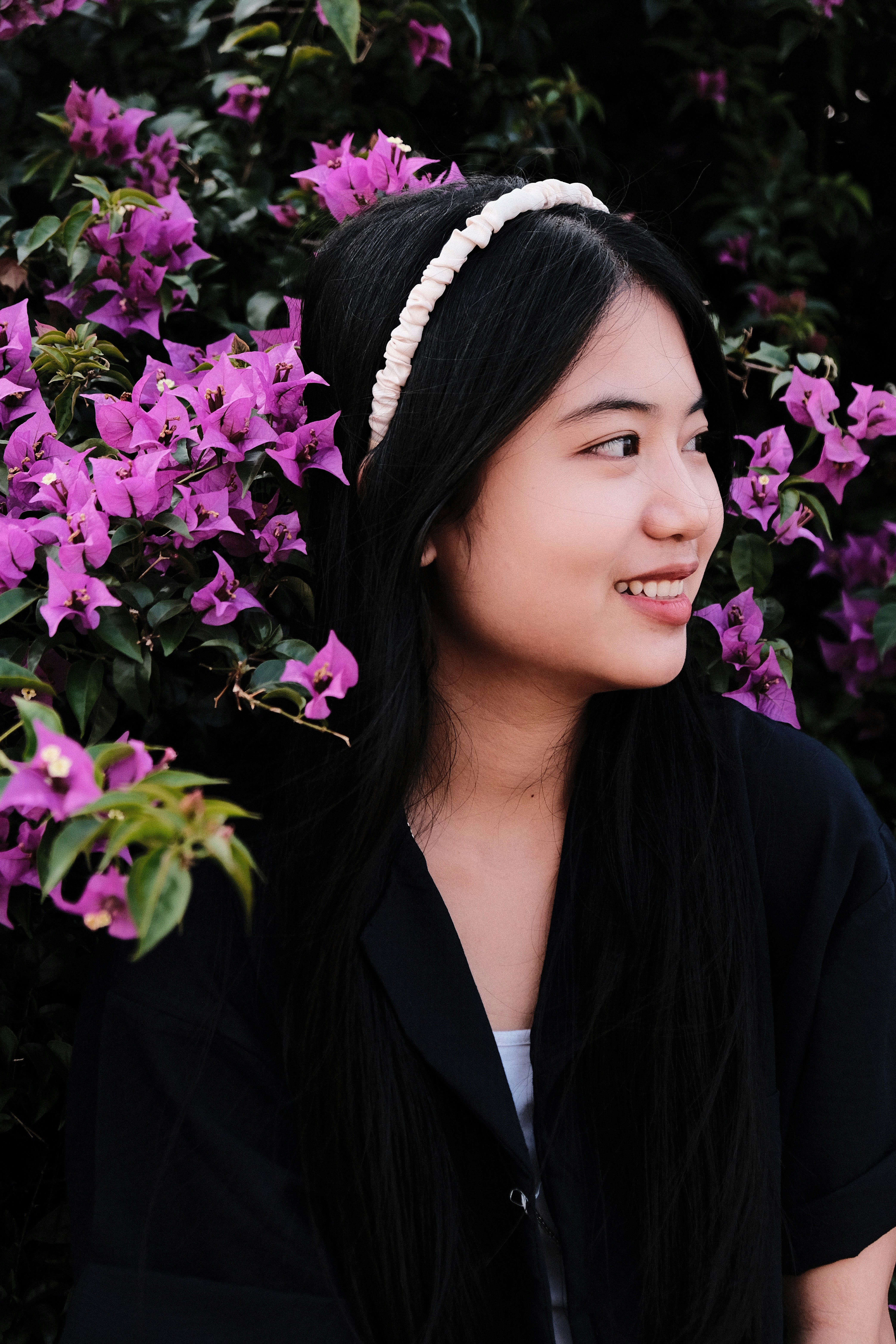 A woman with long black hair wearing a headband photo – Free Purple ...