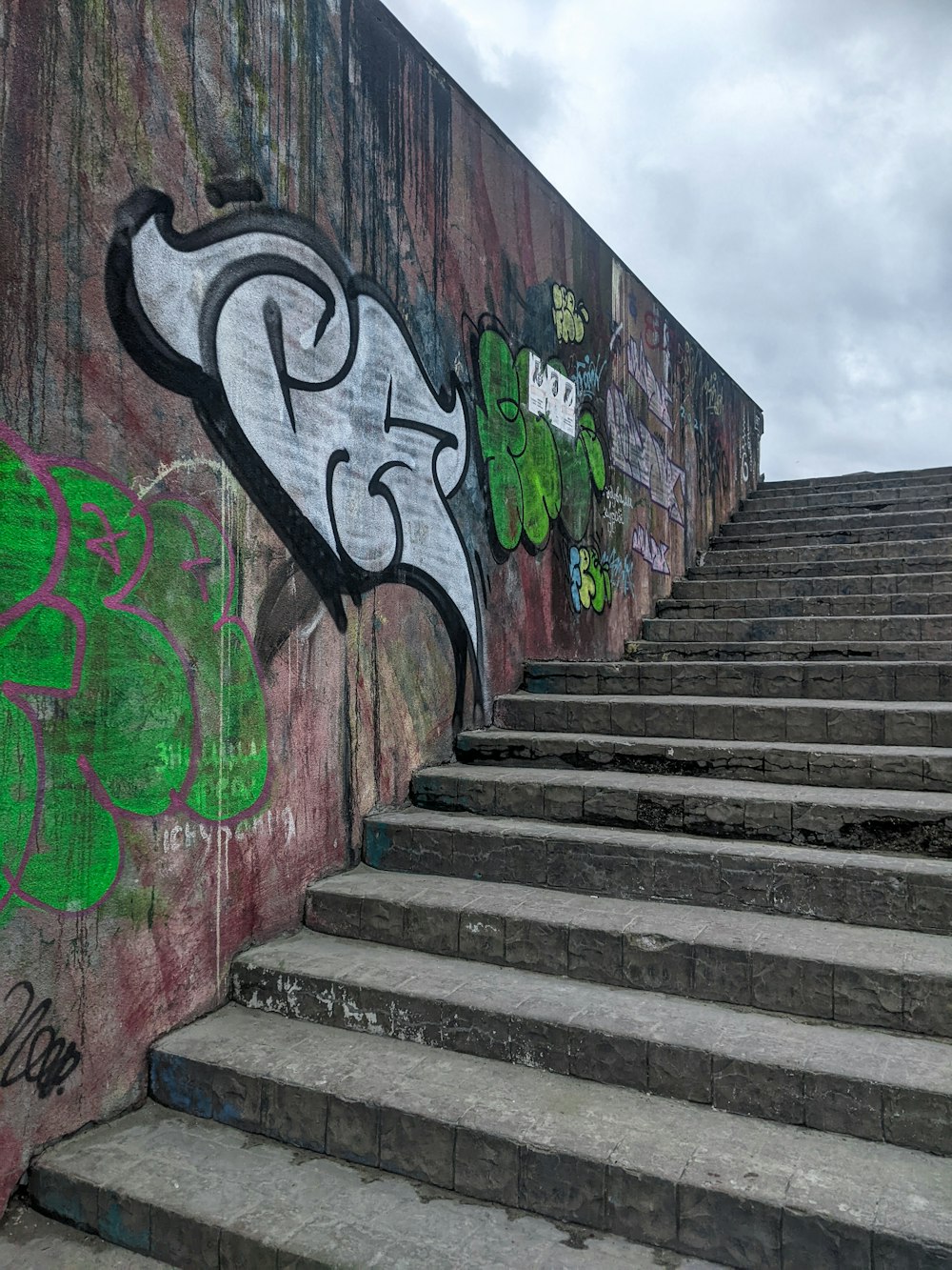 a bunch of steps with graffiti on them