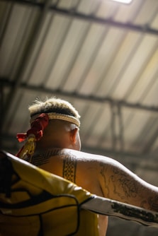 a man with a tattoo on his arm