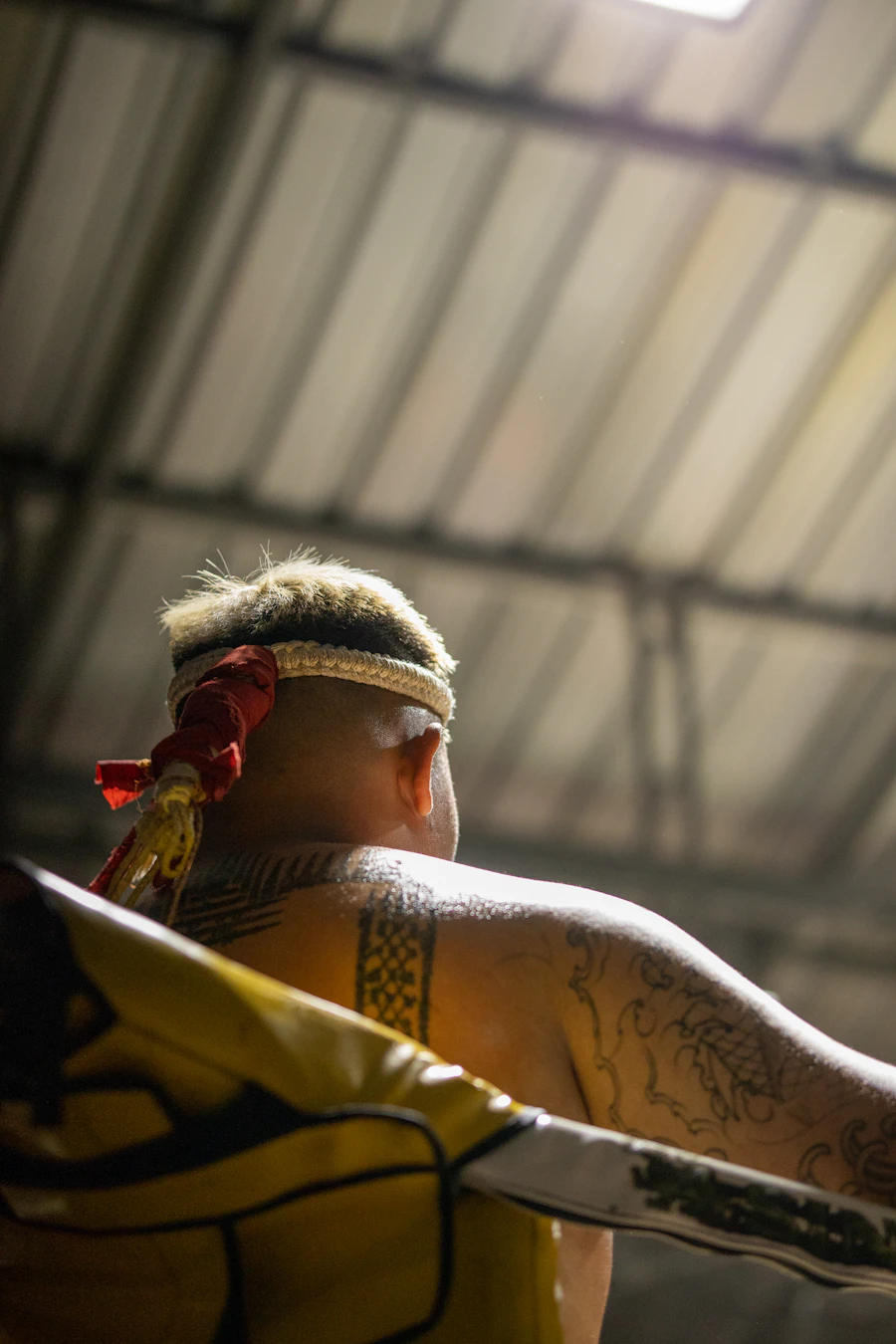 A fighter wearing the mongkol, the braided headband worn into the ring