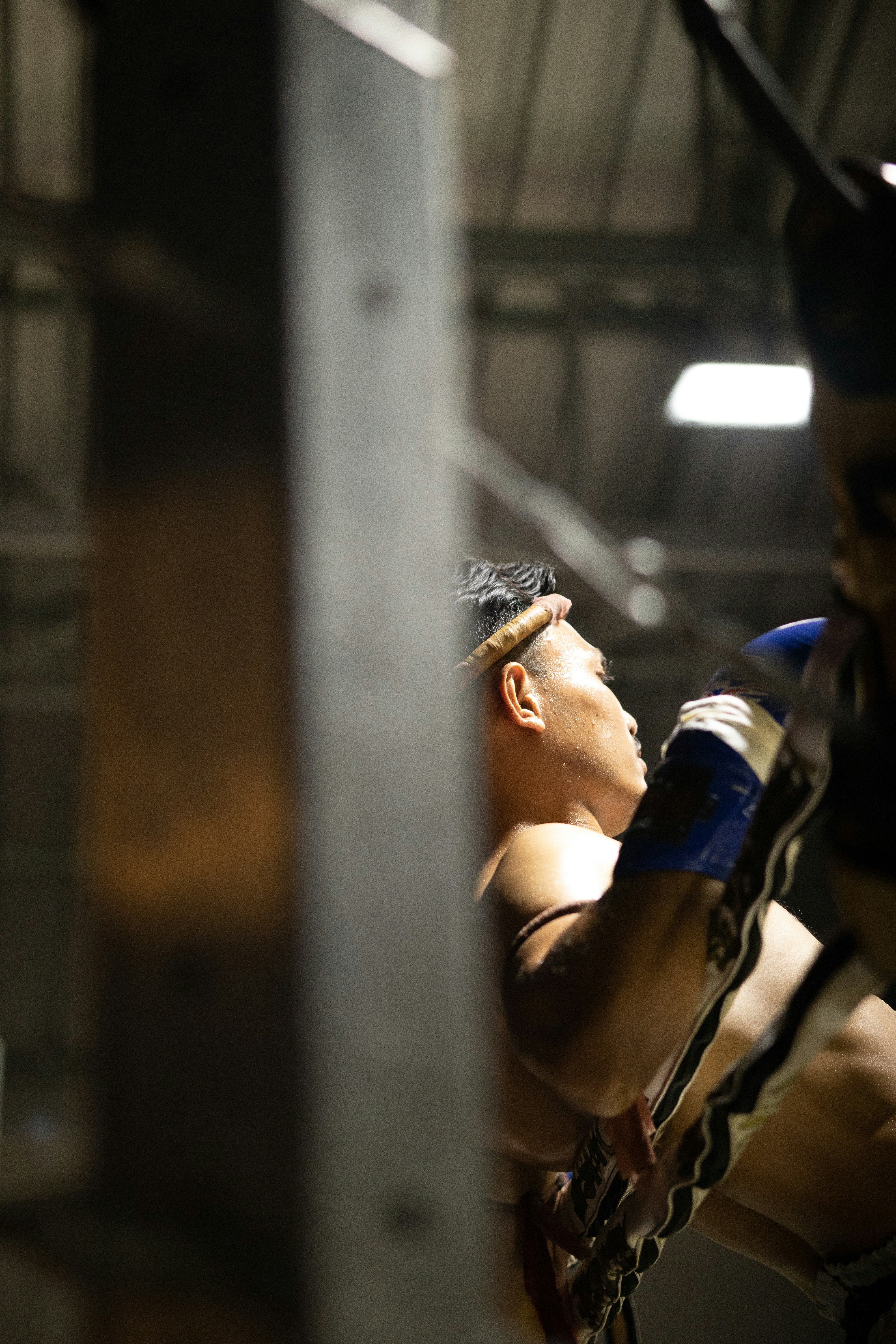 a man in a boxing ring holding a punching glove