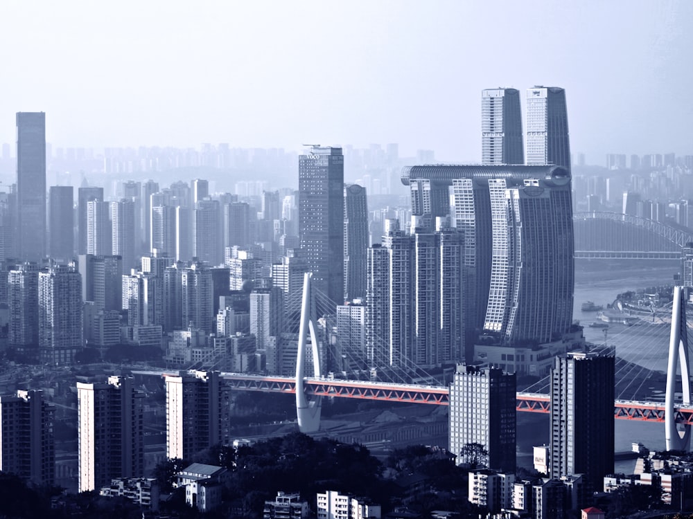 a view of a city with a bridge in the foreground