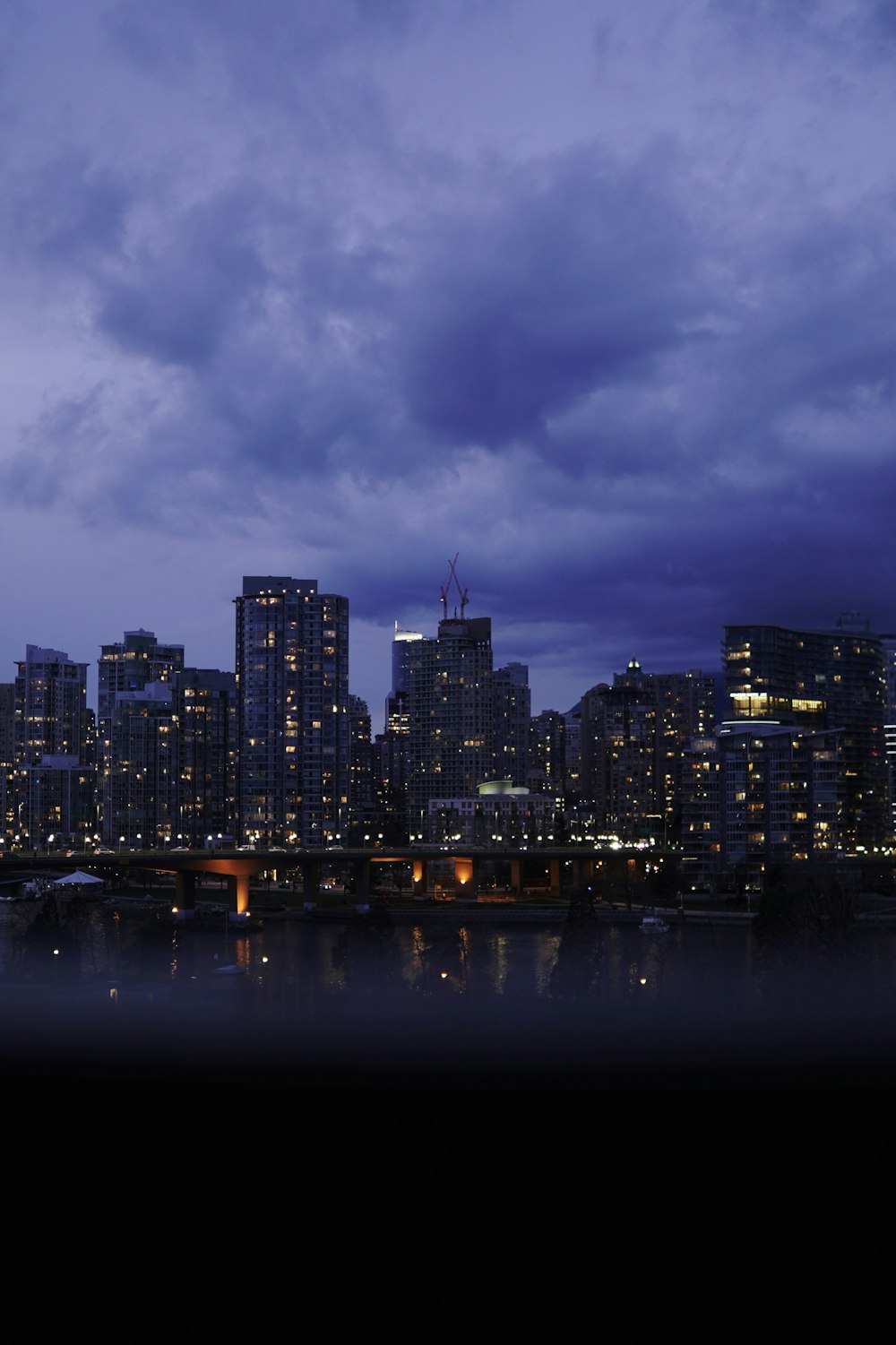 a view of a city at night from across the water