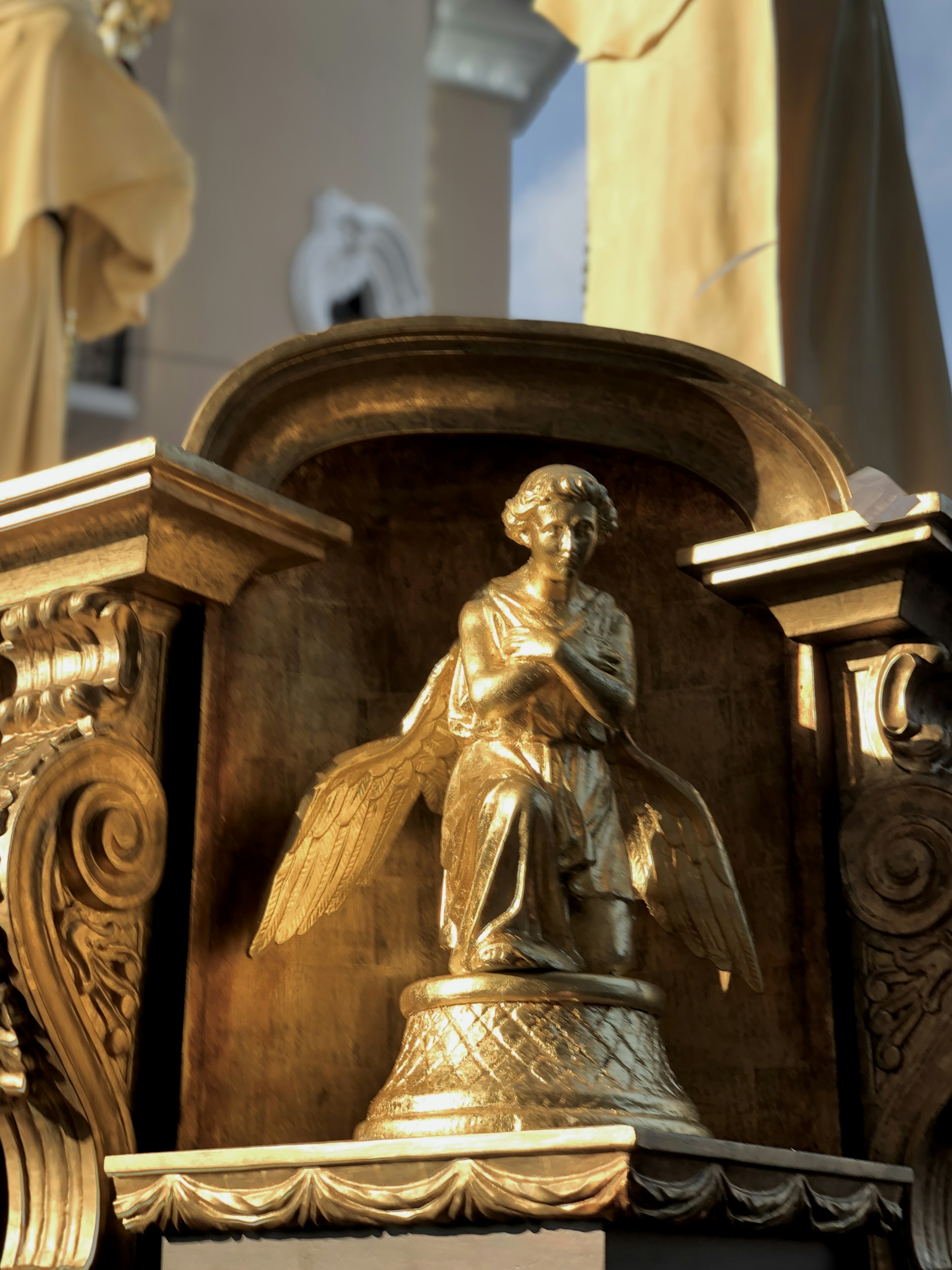 woman wearing yellow long-sleeved dress under white clouds and blue sky during daytime
