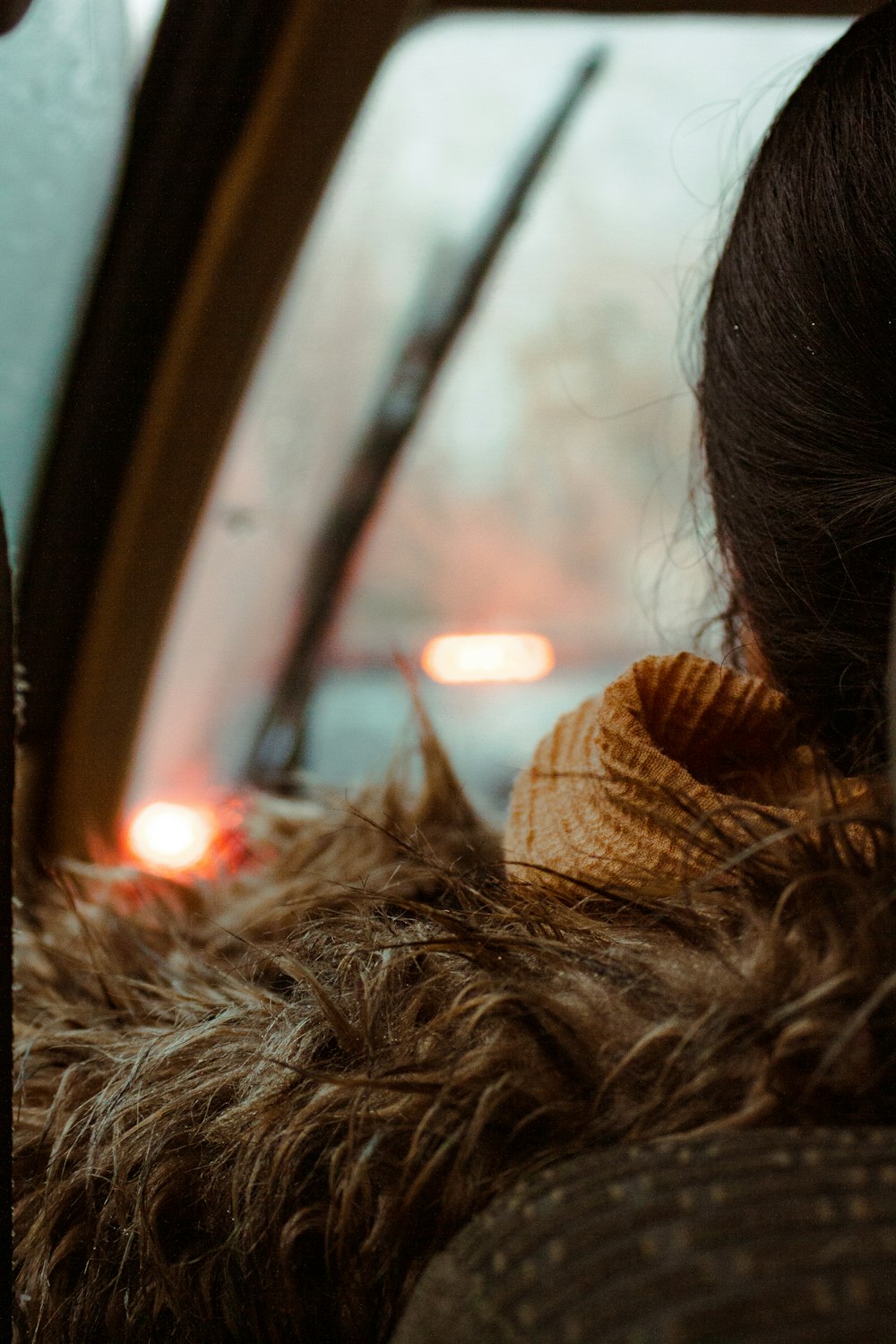 a close up of a person sitting in a vehicle