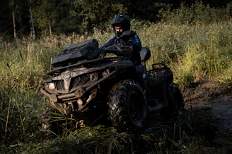 a man riding on the back of an atv