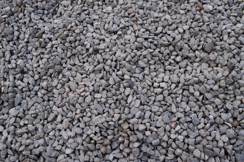Gravel made of silica stones neatly arranged in piles.