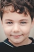 a close up of a child's face smiling