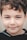 a close up of a child's face smiling