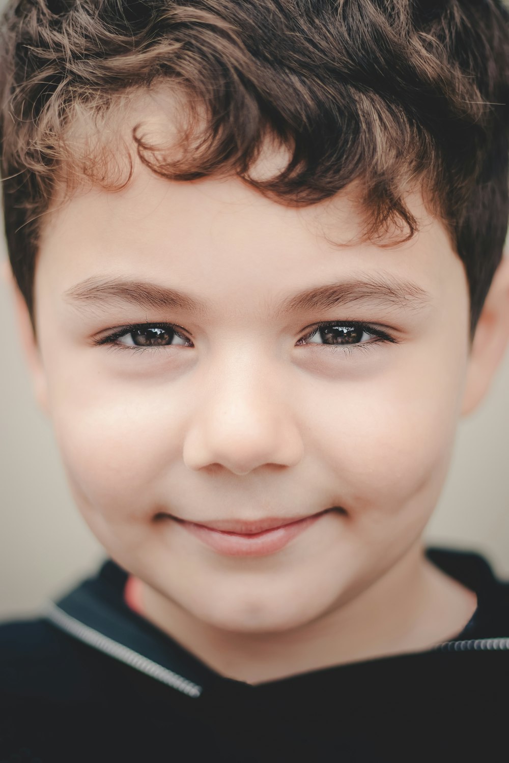 a close up of a child's face smiling