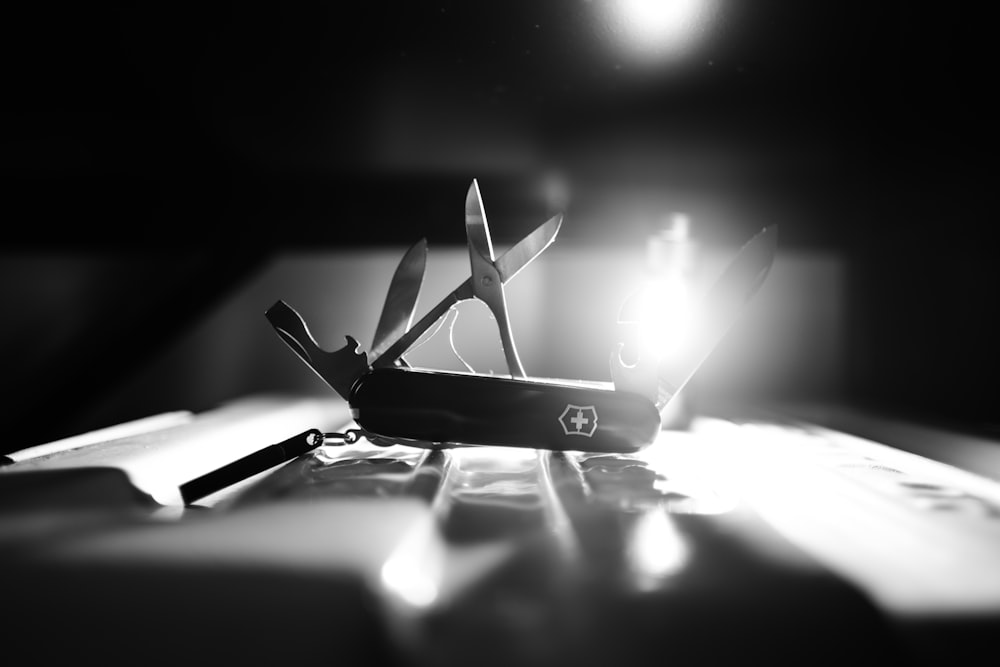 a pair of scissors sitting on top of a table