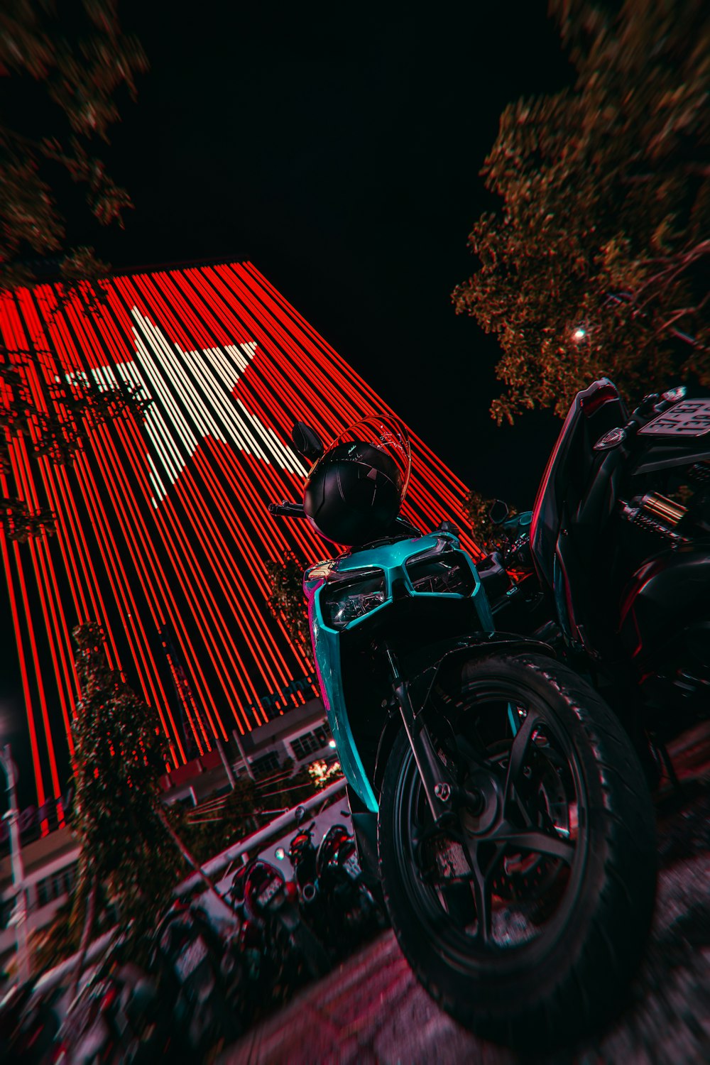 a motorcycle parked in front of a red building