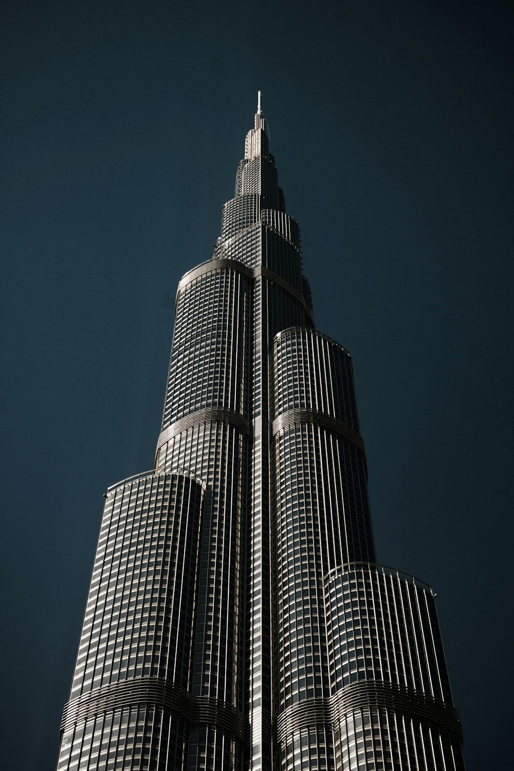 a very tall building with a sky background