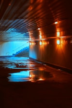 a long hallway with a bunch of lights on it