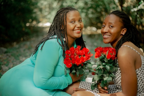 a couple of women sitting next to each other