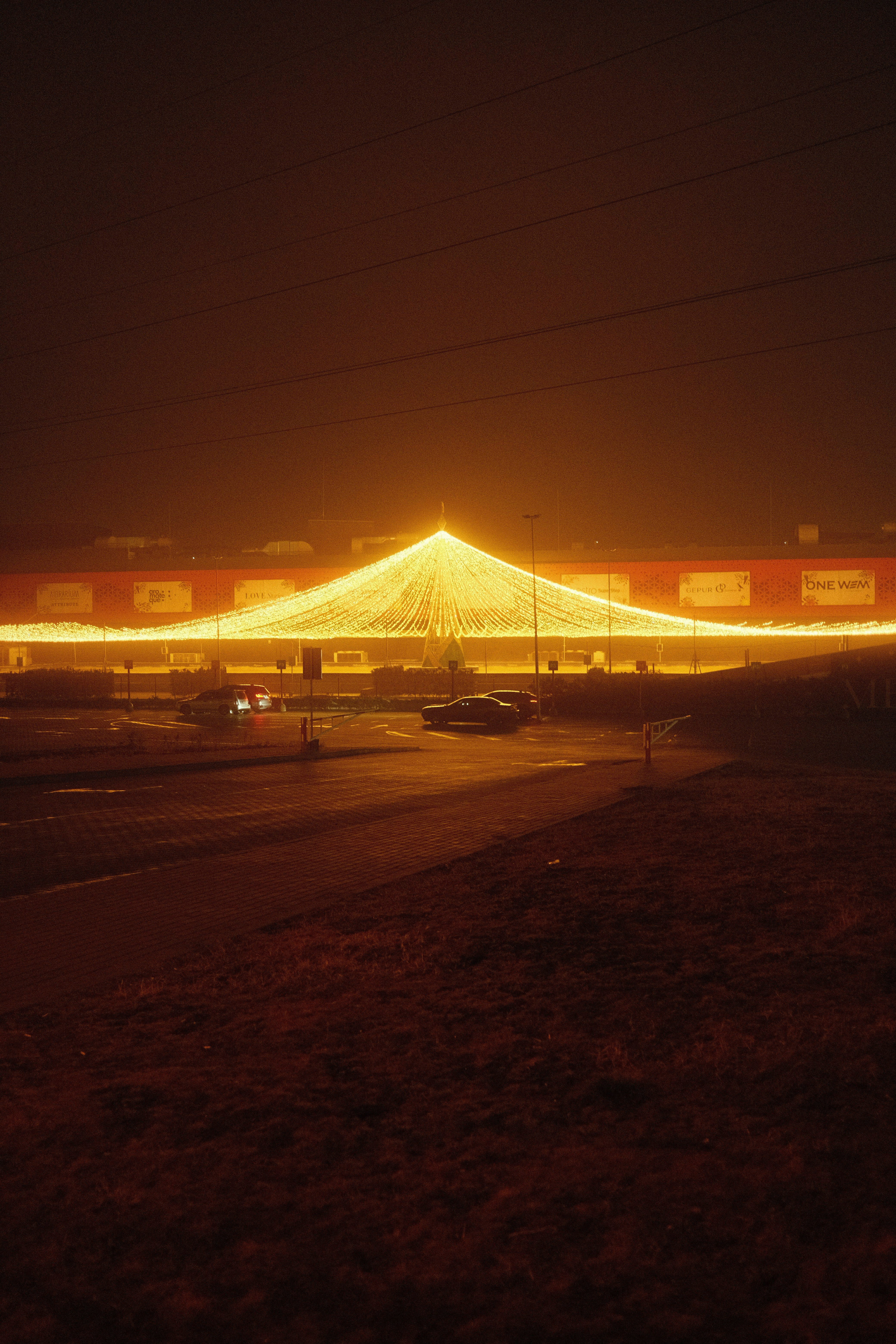 a large circus tent lit up at night