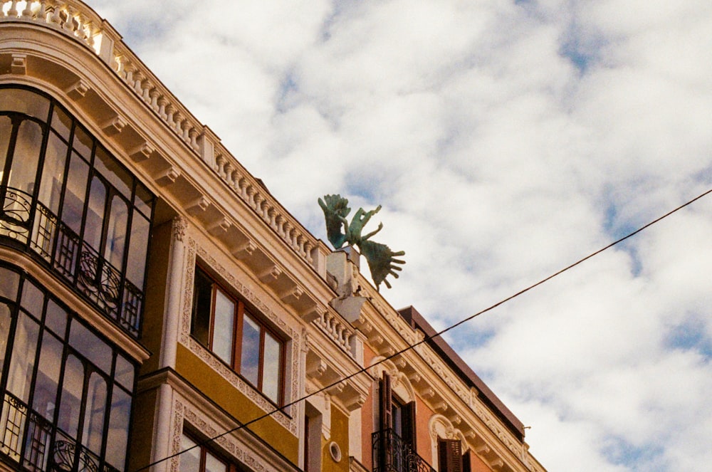 a building with a statue on top of it