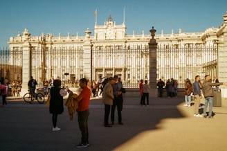 a group of people standing in front of a building
